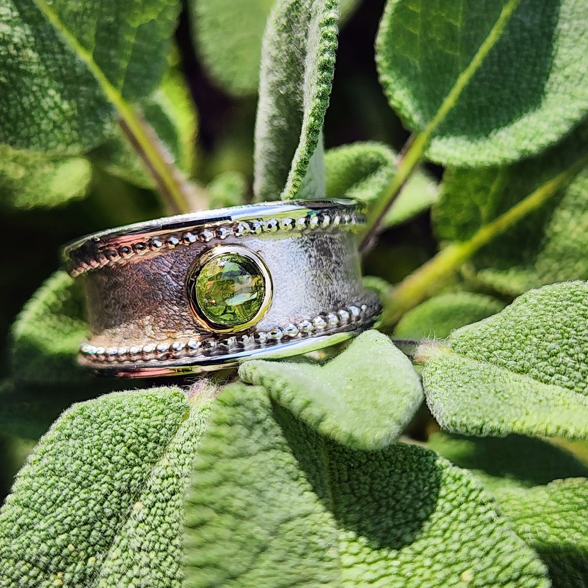 Handmade Sterling silver, gold and Peridot (August birthstone)ring. Size P1/2 but can be altered a little either way, hallmarked and Free UK postage.
