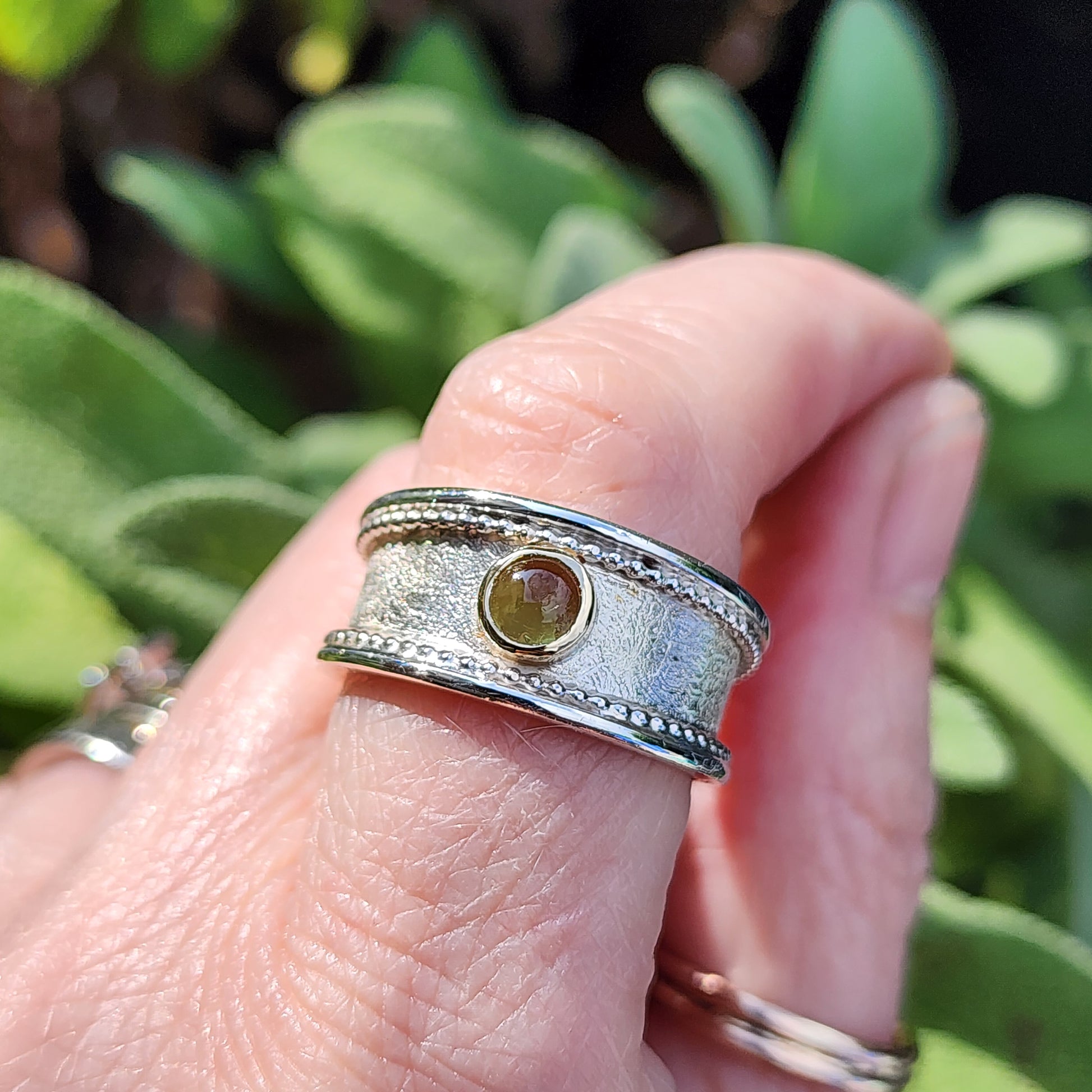 Handmade Sterling silver, gold and Peridot (August birthstone)ring. Size P1/2 but can be altered a little either way, hallmarked and Free UK postage.