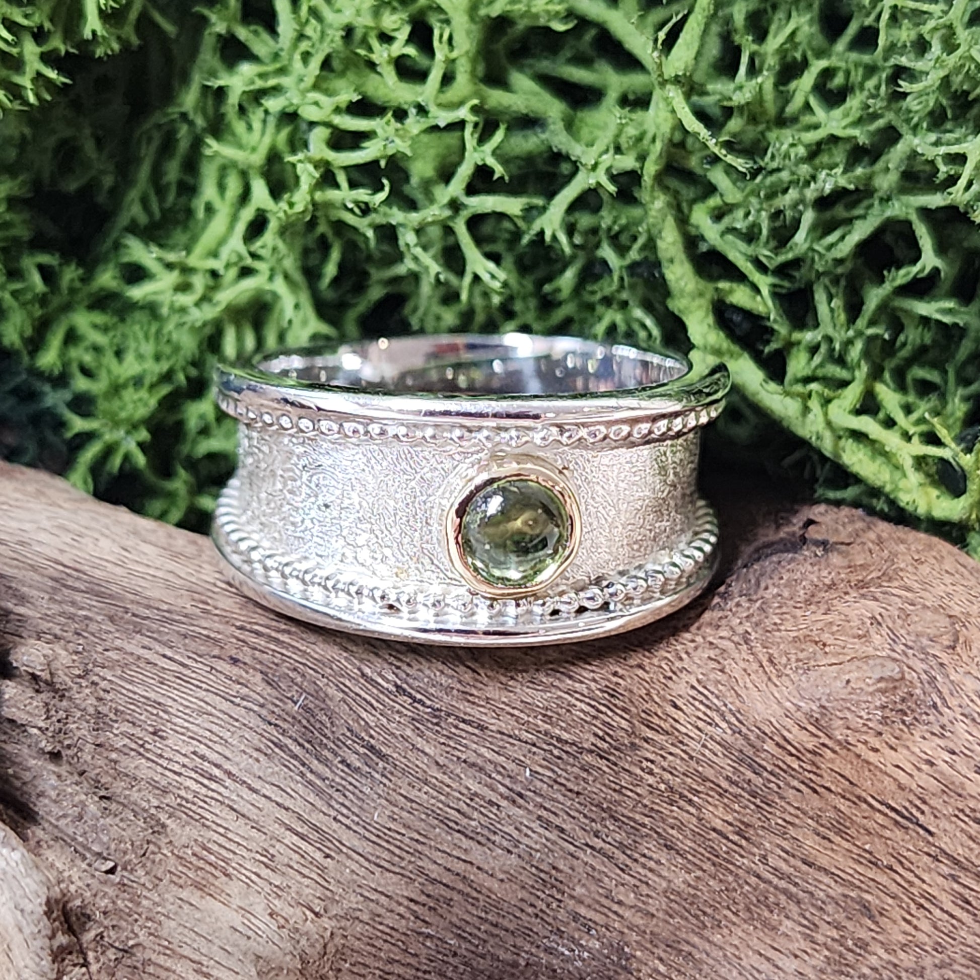 Handmade Sterling silver, gold and Peridot (August birthstone)ring. Size P1/2 but can be altered a little either way, hallmarked and Free UK postage.