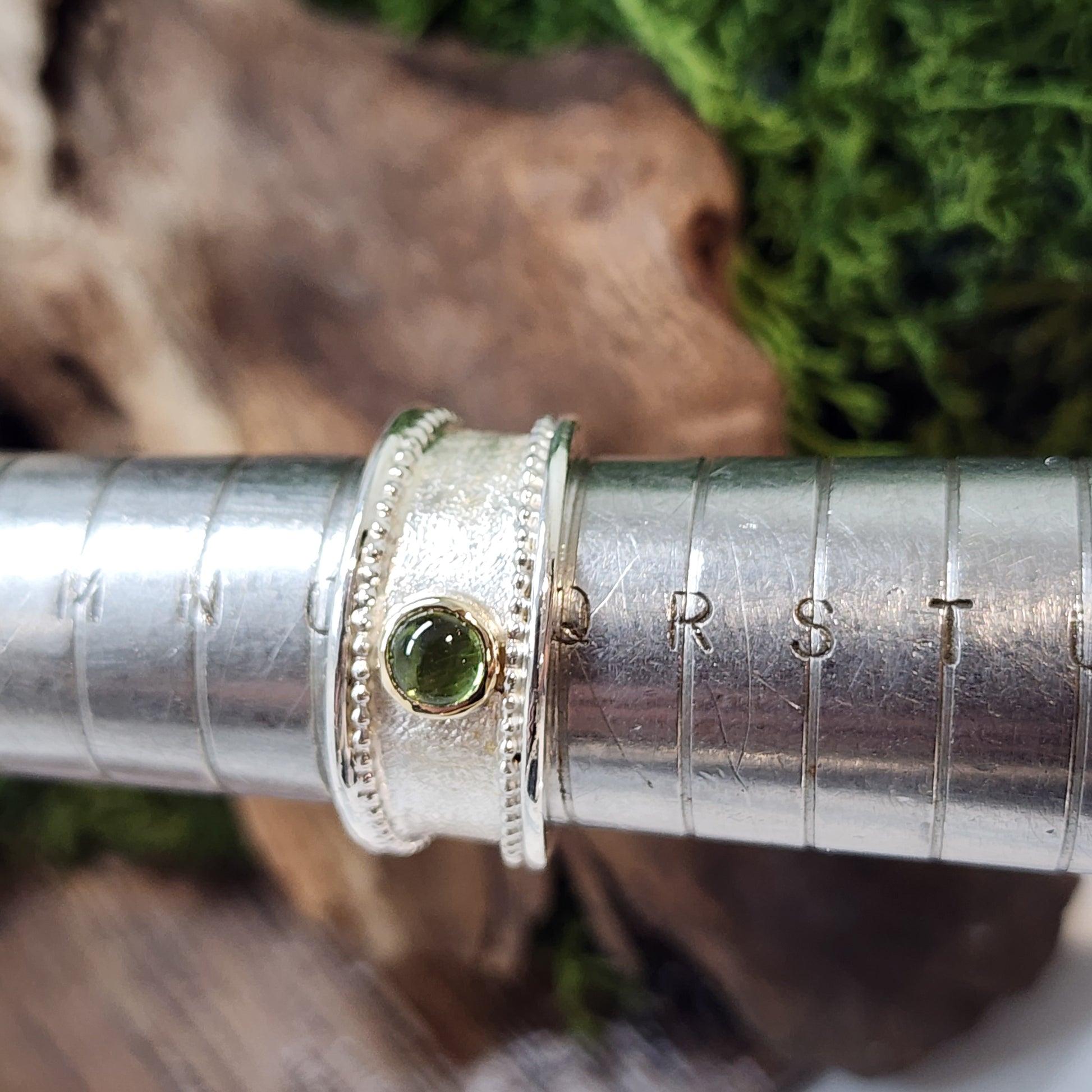 Handmade Sterling silver, gold and Peridot (August birthstone)ring. Size P1/2 but can be altered a little either way, hallmarked and Free UK postage.